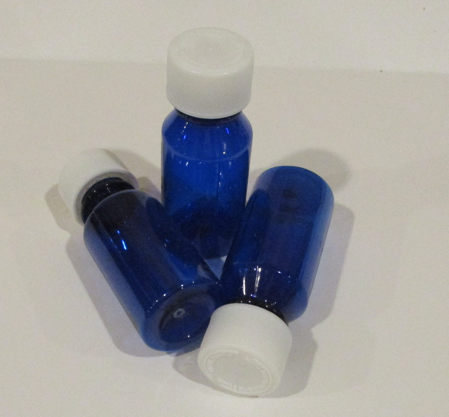 1 Ounce Graduated Oval Plastic Medical Bottles With CR Caps-Amber-Green, or Cobalt Blue-Case of 200 Units